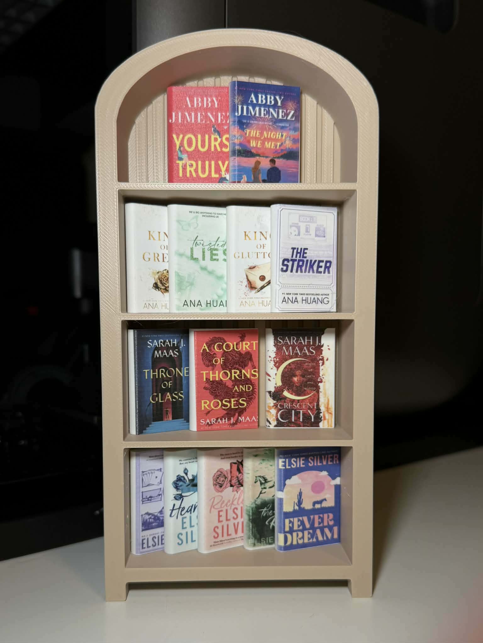 3D printed mini bookshelf filled with miniature books
